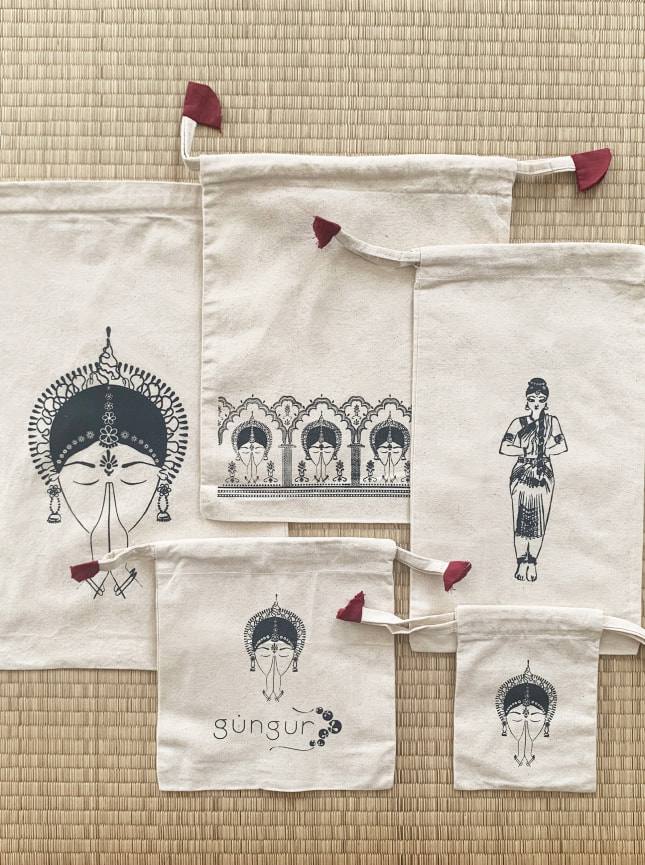 ByGungngur travel bags are a set of five natural cotton bags of different sizes which are perfect for storing your jewllery, hair accesories, hygiene and hair products, make up and if you're an Indian classical dancer, your ghungeroos too. Travel with your bits and pieces in order and in style. sizes: XL (40cm x 20cm) L (19cm x 30cm) M (25cm x 30cm) S (20cm x 20cm) XS (10cm x 15cm)