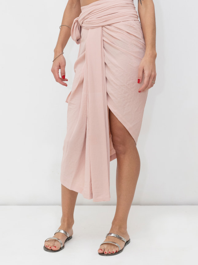 The ByGungur pastel wraparound dress is a one of a kind item. A multiuse maxi wrap dress it can also be worn as a wrap skirt. The skirt is asymetric, longer at one side than the other and worn with a central pleat.