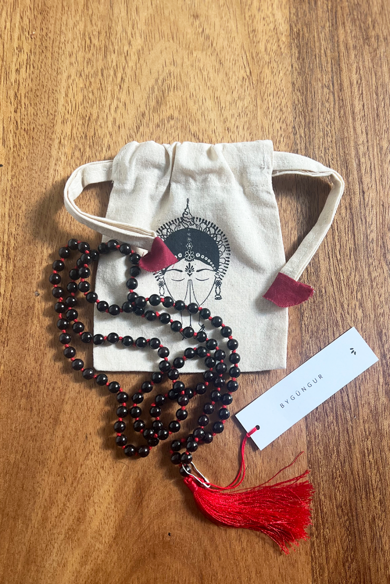 ByGungur Garnet Mala necklace. Each mala necklace is made with 108 genuine garnet stones plus the guru bead. The stones are round and highly polished, beautiful to touch and to look at. The mala can be used as an aid to meditation or as beautiful jewlery.